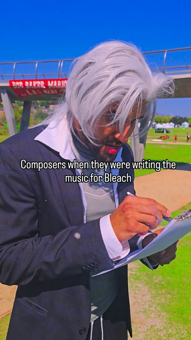 Composers when they were writing the music for Bleach, Xavier in a white wig at a desk